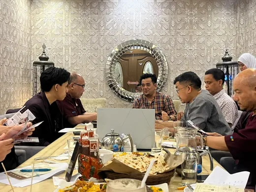Committee members in discussion at the meeting table