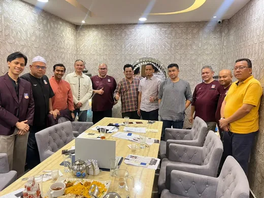 Committee members photographed together before the meeting began