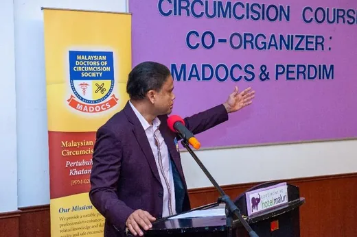 Speaker delivering a lecture at Comprehensive Circumcision Course 1