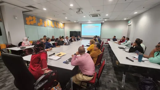 Meeting members reviewing guideline documents