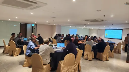 MADOCS course hall filled with participants