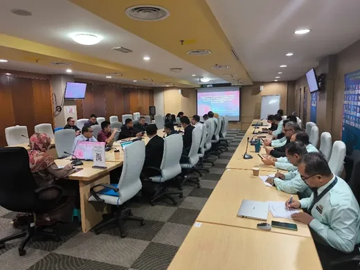 Ministry meeting participants listening to a presentation