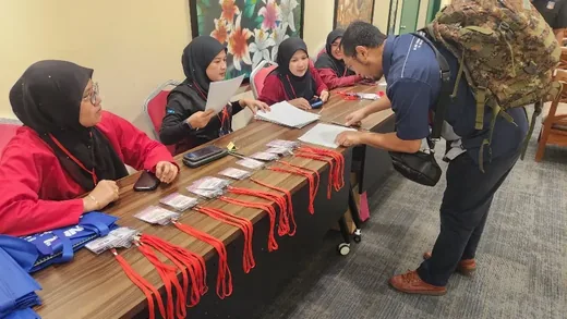 Meeting participants at a long table